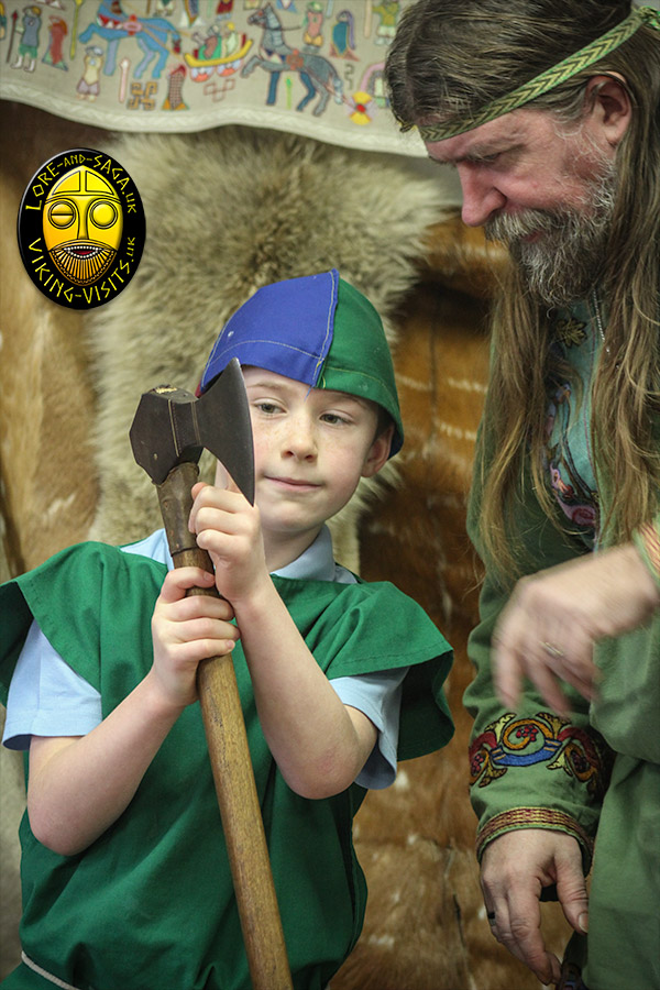 School child asking a question about a Viking axe - Part of an classroom presentation by Lore and Saga - Image copyrighted © Gary Waidson. All rights reserved.